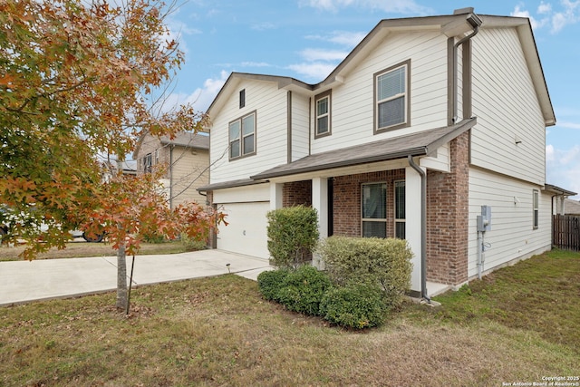 view of front of property with a front yard and a garage