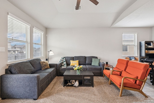 living room featuring ceiling fan and light tile patterned floors