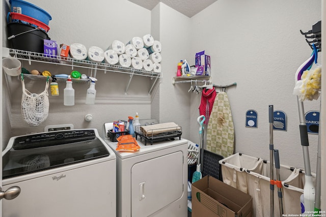 laundry room featuring washing machine and clothes dryer