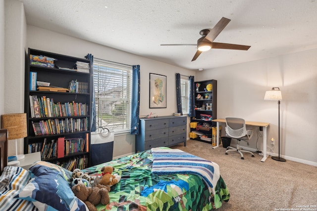 bedroom with a textured ceiling, ceiling fan, and carpet flooring