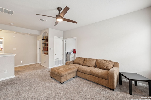 living room featuring ceiling fan and light colored carpet