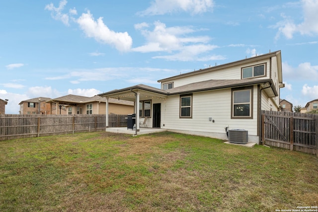 back of property featuring a patio area, a lawn, and central air condition unit