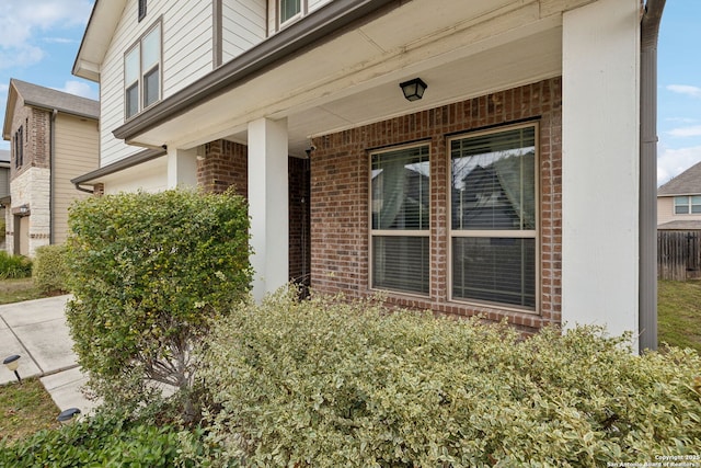 view of exterior entry featuring covered porch