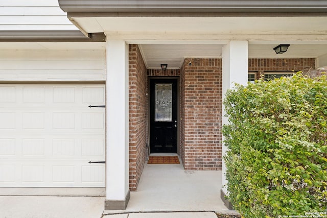 doorway to property featuring a garage