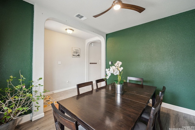 dining space featuring ceiling fan and hardwood / wood-style floors