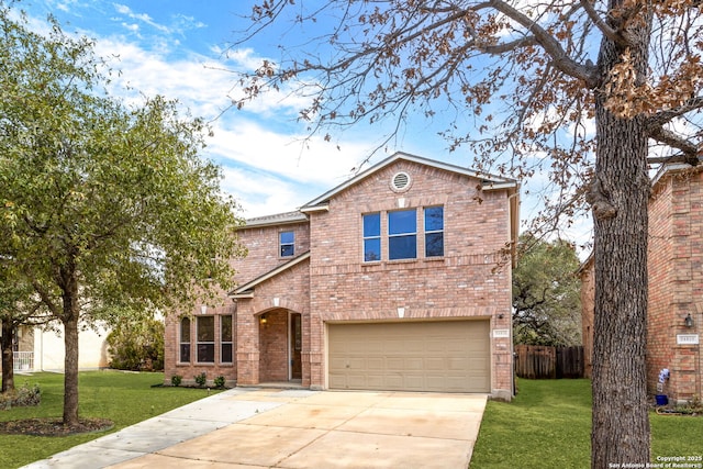 view of property featuring a garage and a front yard