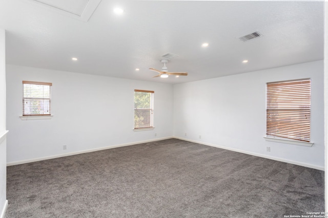 carpeted empty room featuring ceiling fan