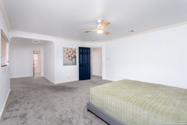 bedroom featuring ceiling fan, carpet floors, and crown molding