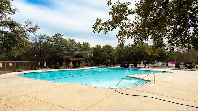 view of swimming pool with a patio