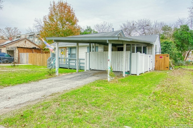 view of outbuilding featuring covered porch and a yard