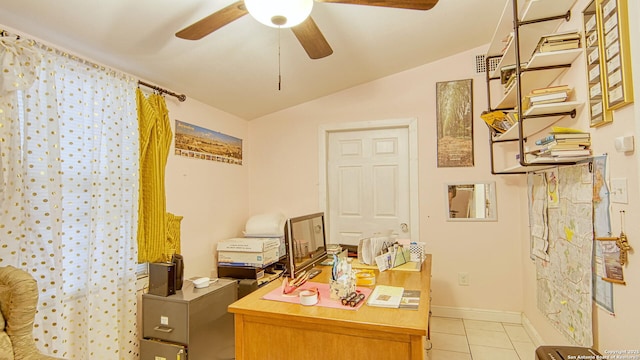 office area with lofted ceiling, ceiling fan, and light tile patterned flooring