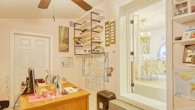 bathroom with lofted ceiling and ceiling fan with notable chandelier