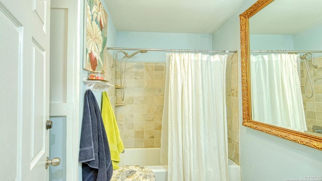 bathroom featuring shower / tub combo with curtain