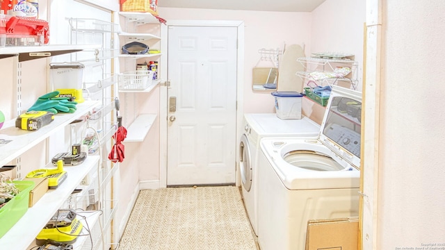 laundry area with washing machine and clothes dryer