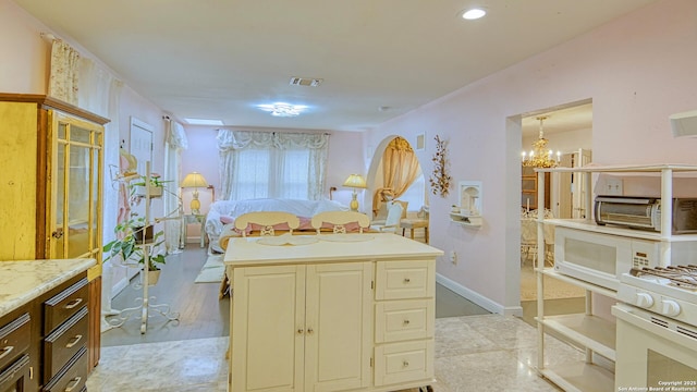 bathroom featuring a notable chandelier