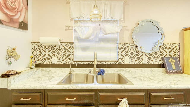 kitchen featuring sink and dark brown cabinetry