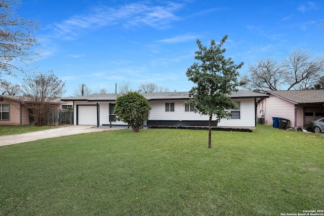 ranch-style home featuring a garage and a front yard