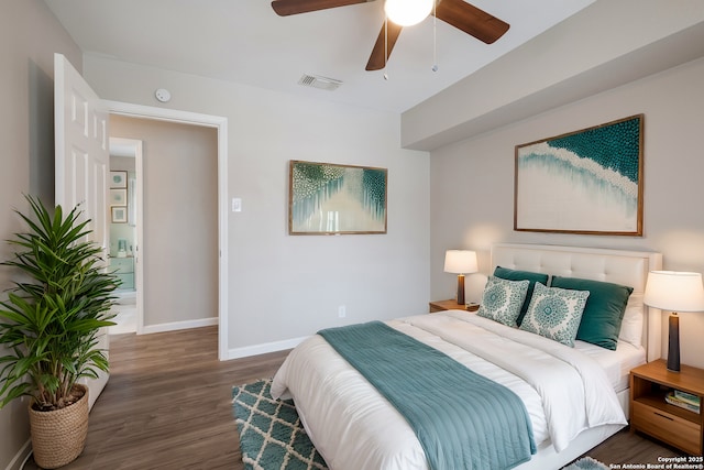 bedroom with ceiling fan and dark hardwood / wood-style flooring