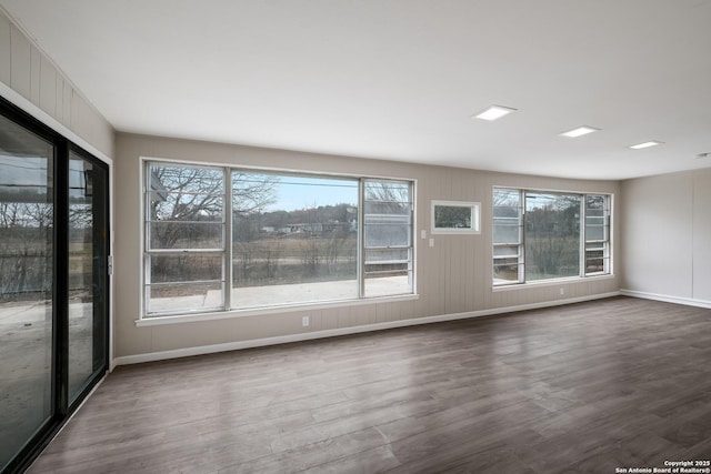 spare room featuring dark wood-type flooring