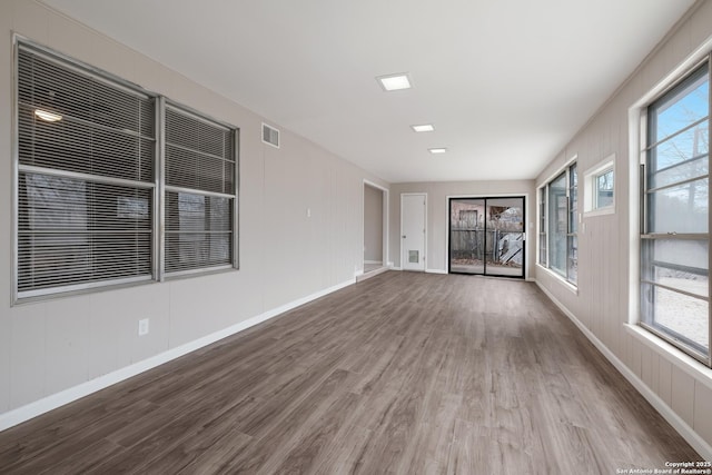 unfurnished room featuring hardwood / wood-style flooring