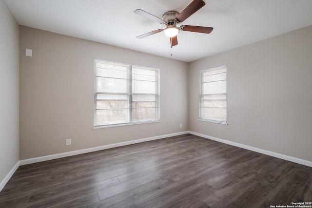 unfurnished room featuring ceiling fan and dark wood-type flooring