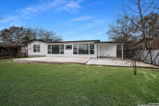 rear view of property with a patio area and a yard