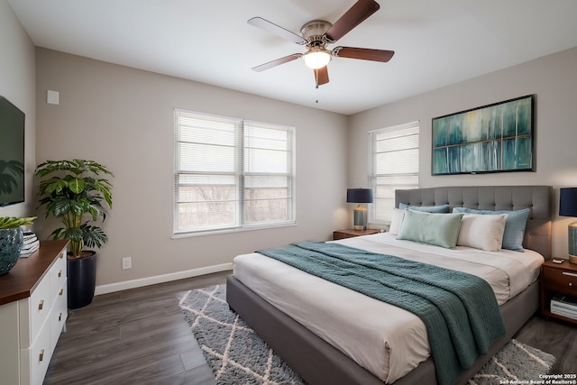 bedroom with ceiling fan and dark hardwood / wood-style floors