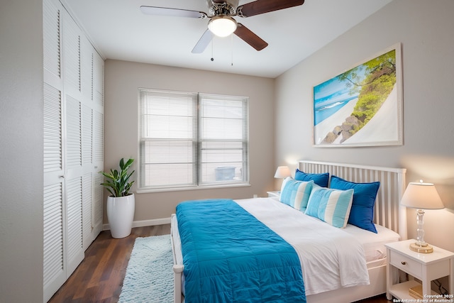 bedroom with ceiling fan, a closet, and dark hardwood / wood-style flooring