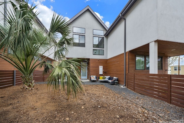 view of side of home with outdoor lounge area