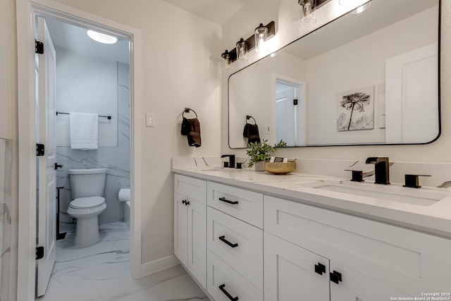 bathroom featuring toilet and vanity