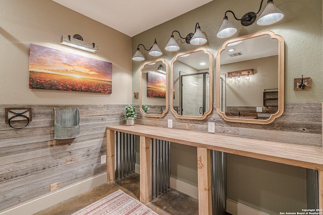 bathroom with concrete floors and vanity