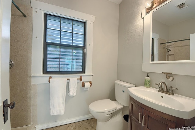 full bathroom with visible vents, vanity, and toilet