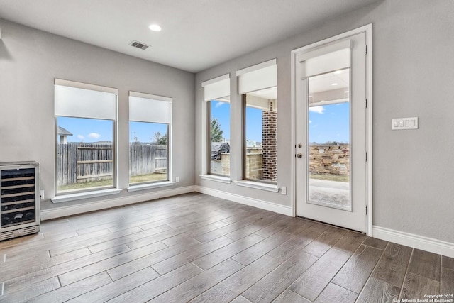 interior space featuring plenty of natural light and beverage cooler