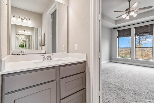 bathroom featuring ceiling fan and vanity