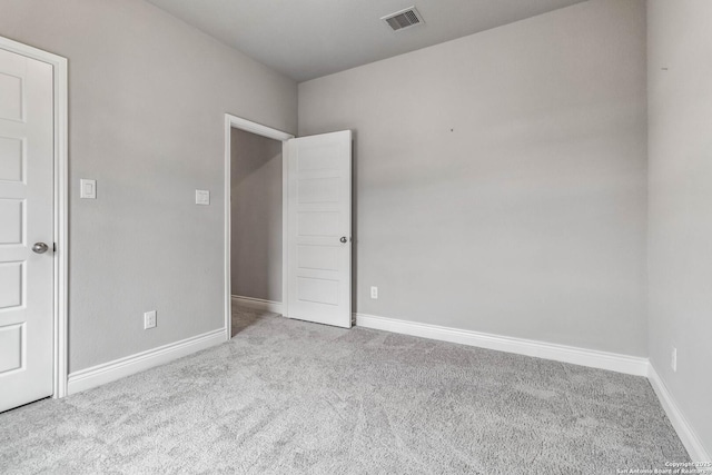 spare room with light carpet