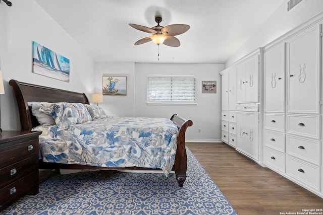 bedroom featuring ceiling fan and dark wood-type flooring