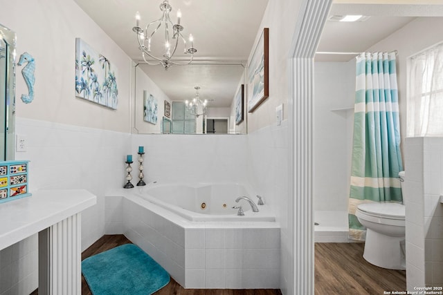 bathroom featuring toilet, a notable chandelier, plus walk in shower, and hardwood / wood-style flooring