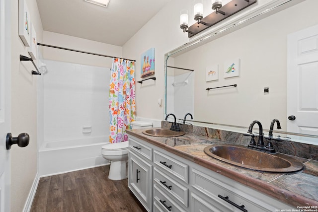 full bathroom featuring toilet, vanity, shower / tub combo, and hardwood / wood-style flooring