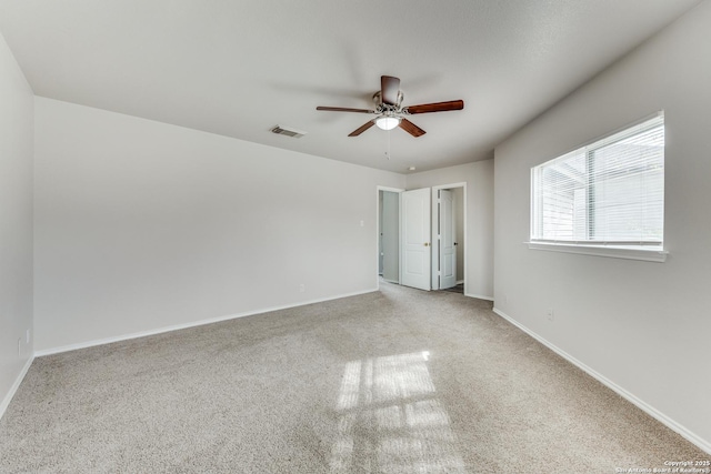 carpeted empty room with ceiling fan