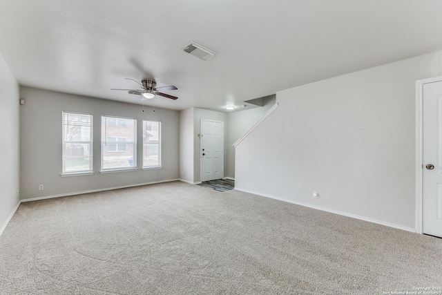 unfurnished living room with ceiling fan and light colored carpet