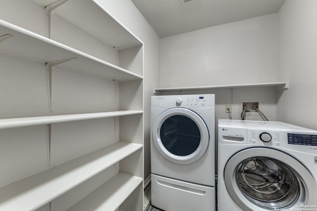 laundry area with washer and dryer