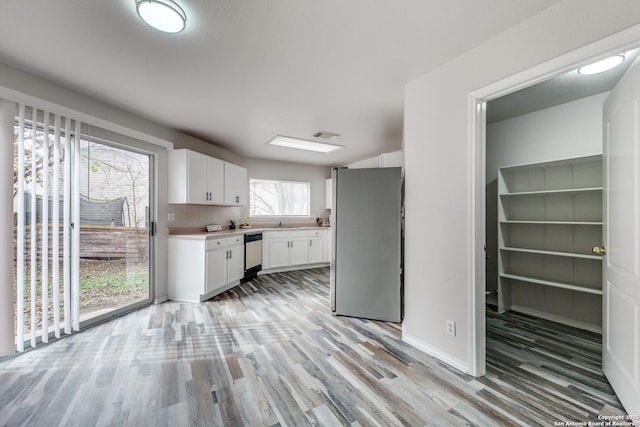 kitchen featuring white cabinetry, appliances with stainless steel finishes, and light wood-type flooring