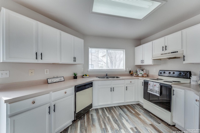 kitchen featuring light wood-type flooring, sink, white cabinets, and white appliances