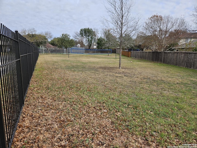 view of yard featuring volleyball court