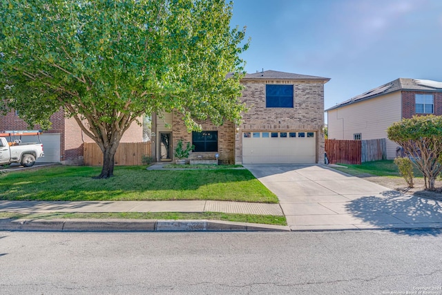 view of front of property with a front lawn and a garage