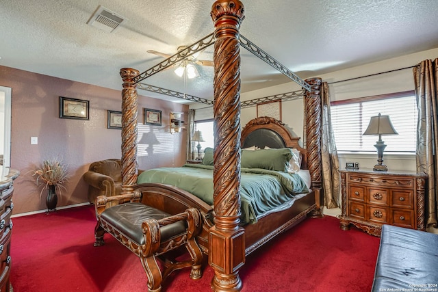 bedroom featuring ceiling fan, a textured ceiling, and carpet