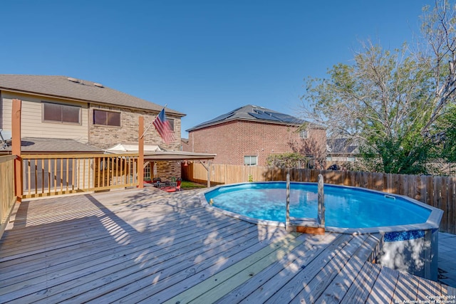 view of pool featuring a wooden deck