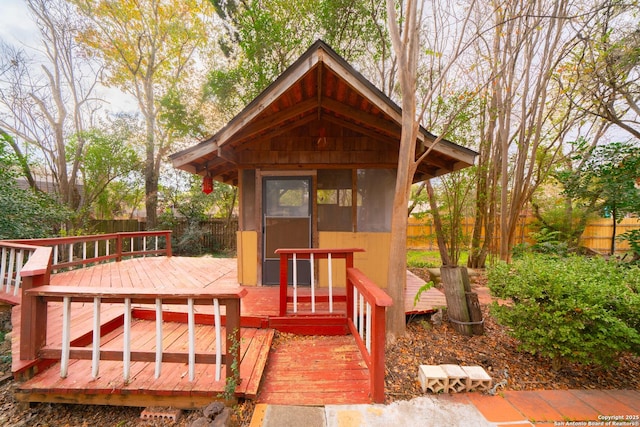 wooden deck with an outdoor structure