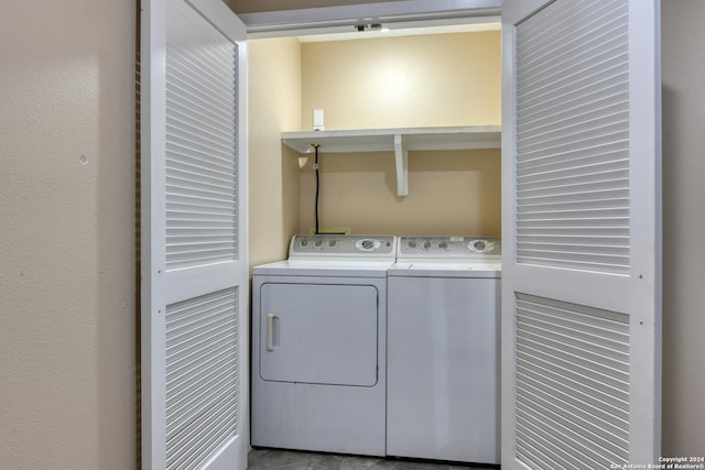 laundry area with independent washer and dryer