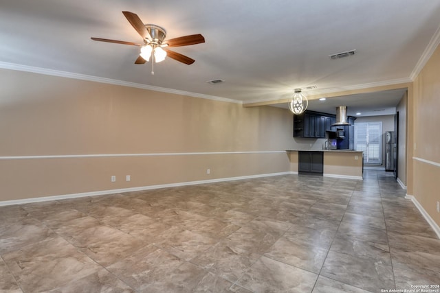 unfurnished living room featuring ceiling fan and crown molding